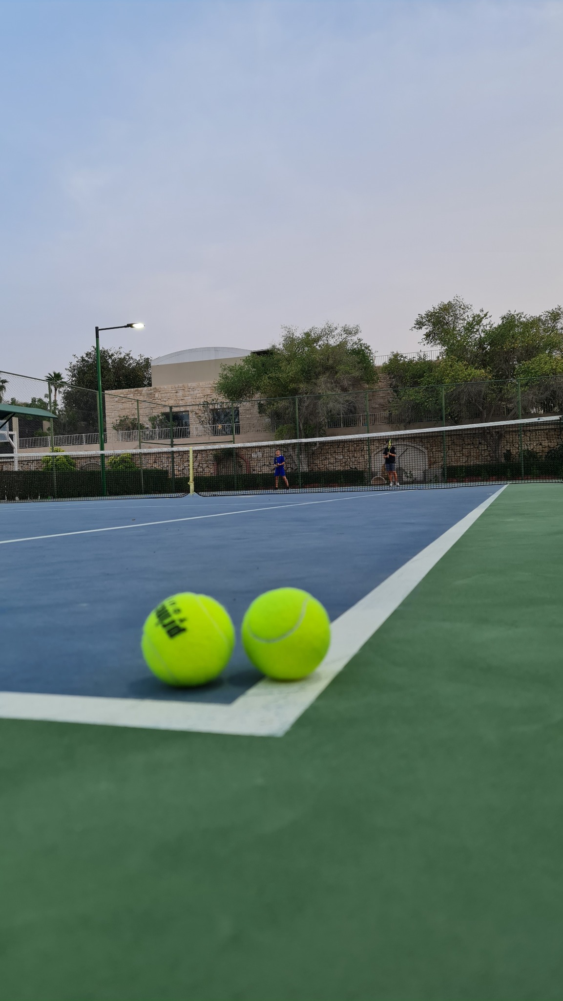 Tennis balls on Desert Palm court